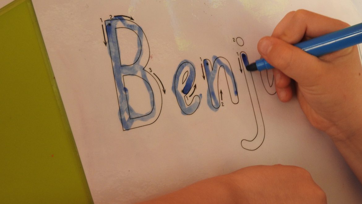 When should I teach my child to write their name?